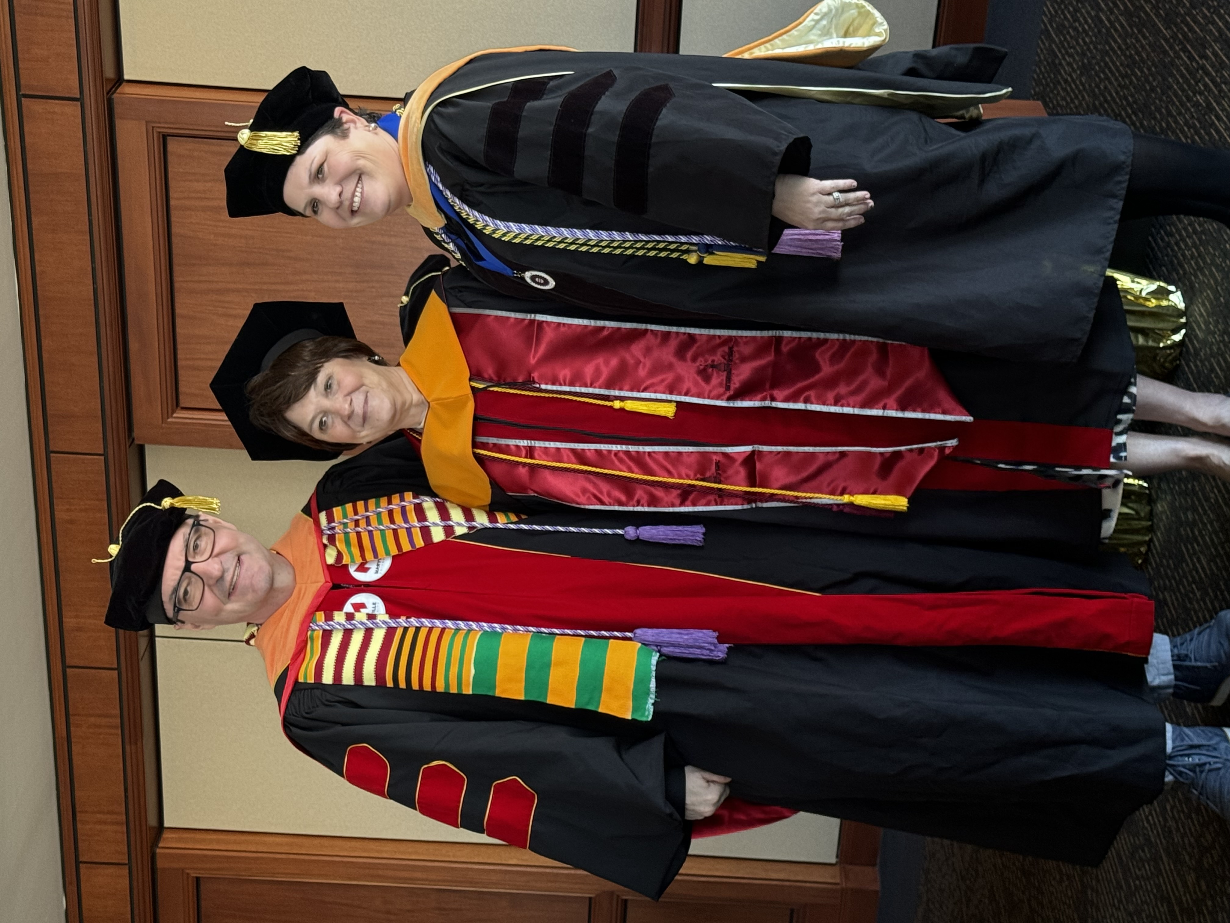 Dr. Julie Carragher at her graduation, pictured in the center